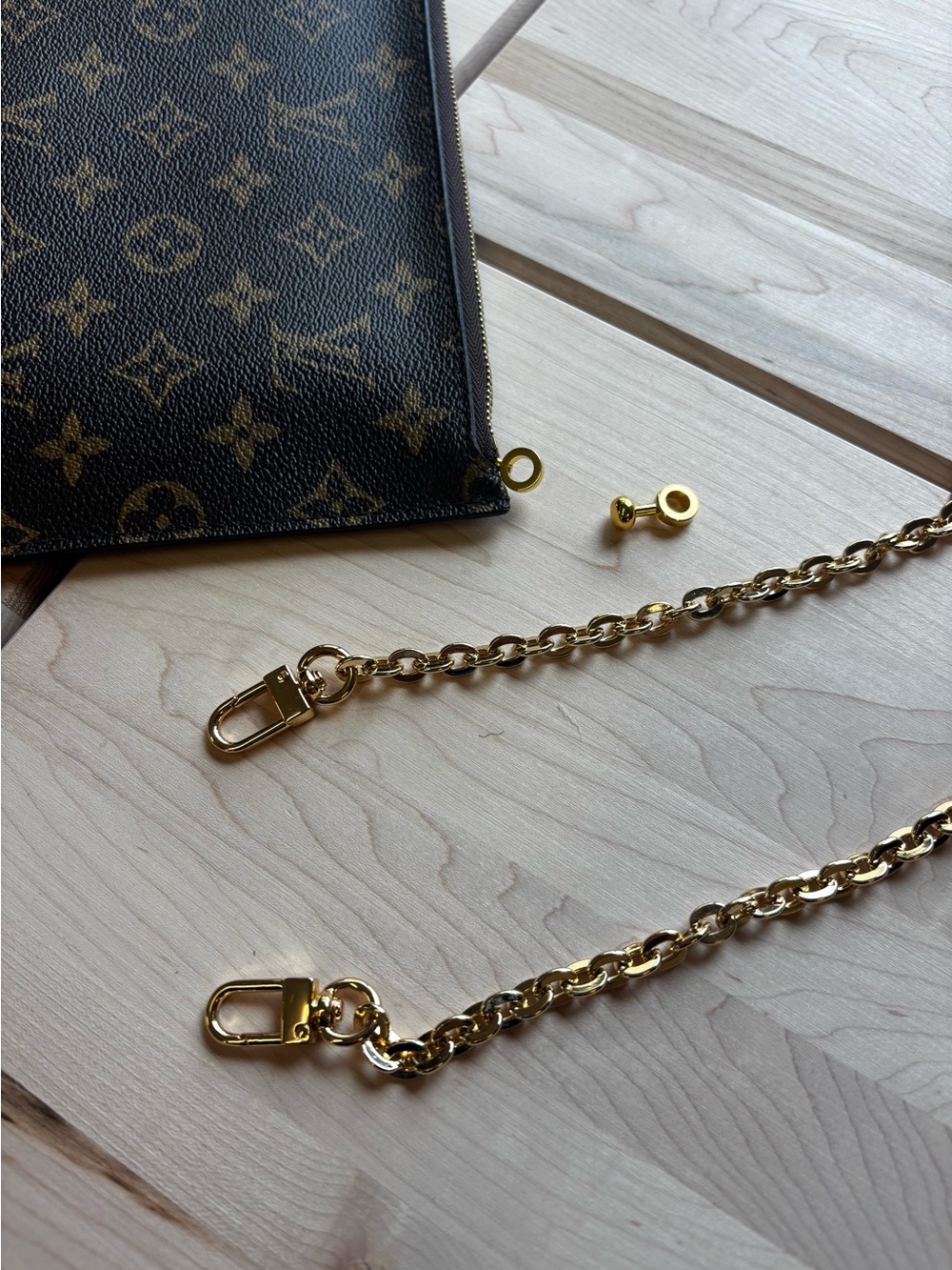 Gold coloured chain and zip buckle insert